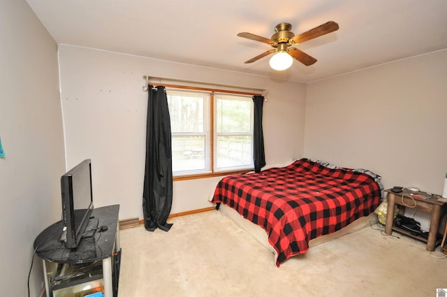 bedroom with ceiling fan and carpet