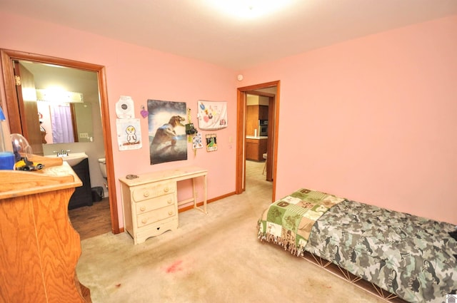 bedroom featuring carpet flooring and sink