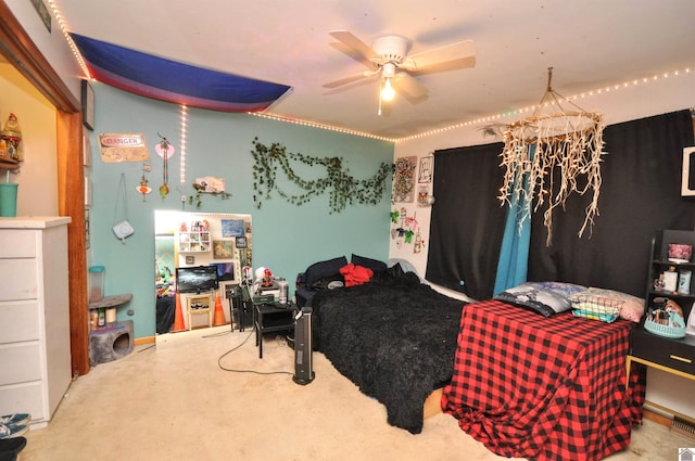 bedroom with ceiling fan and carpet floors