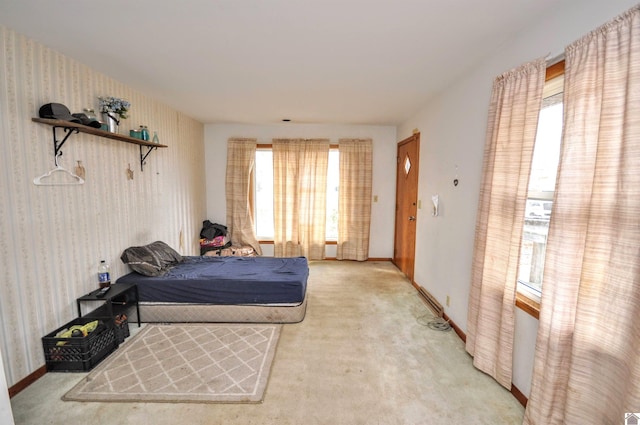 carpeted bedroom with multiple windows