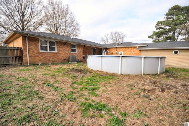 back of property featuring central air condition unit