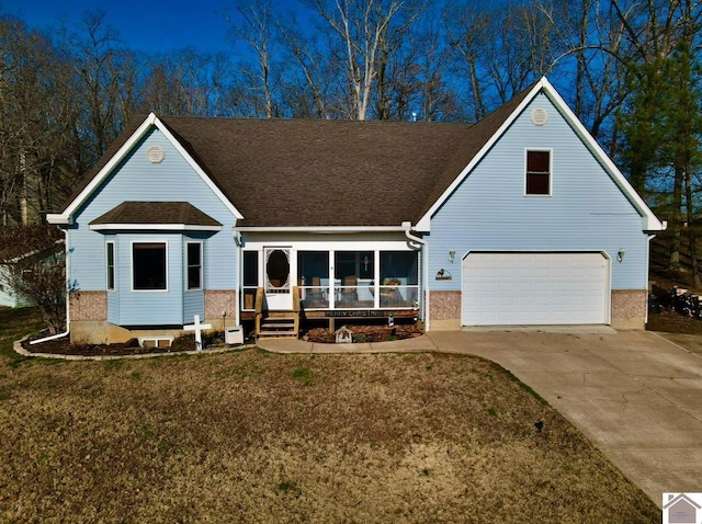 view of front of home featuring a front yard and a garage