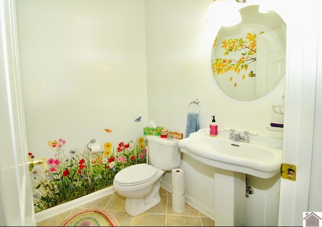 bathroom featuring tile patterned flooring, toilet, and sink