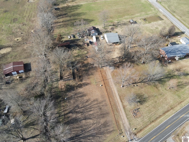 birds eye view of property with a rural view