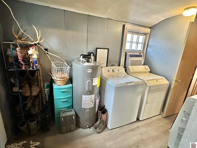 washroom with independent washer and dryer and water heater