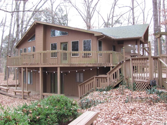 rear view of property featuring a deck