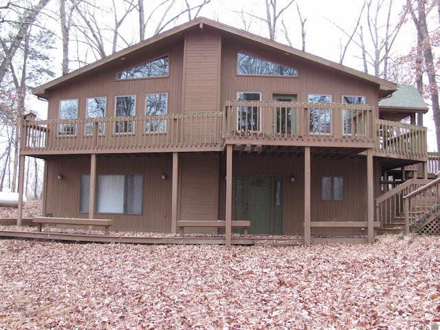 rear view of property featuring a deck