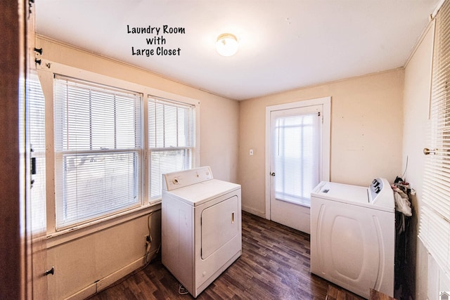 laundry room with separate washer and dryer and dark hardwood / wood-style floors