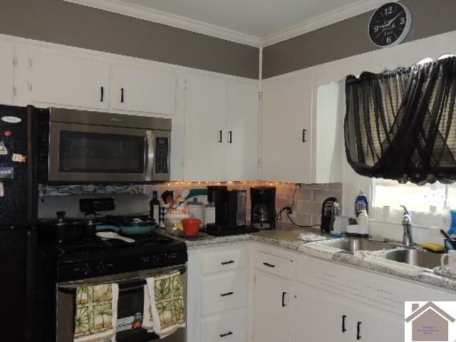 kitchen featuring white cabinetry, sink, black range with gas cooktop, and crown molding