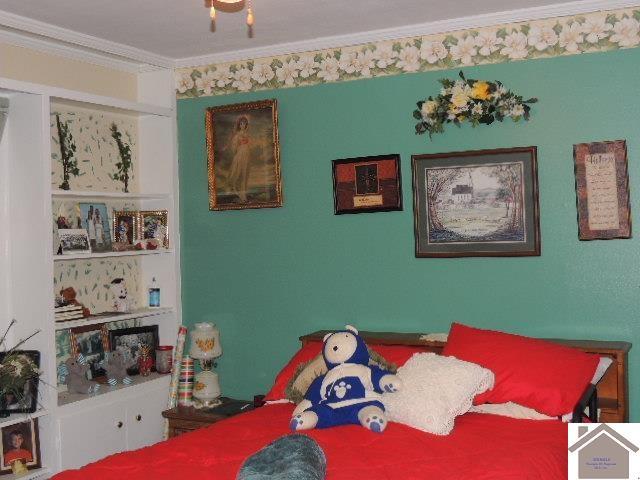 bedroom with ornamental molding