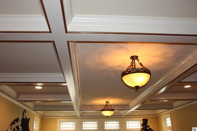 room details with beam ceiling, ornamental molding, and coffered ceiling