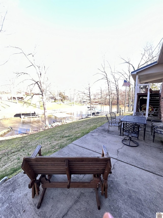 view of home's community with a lawn and a patio