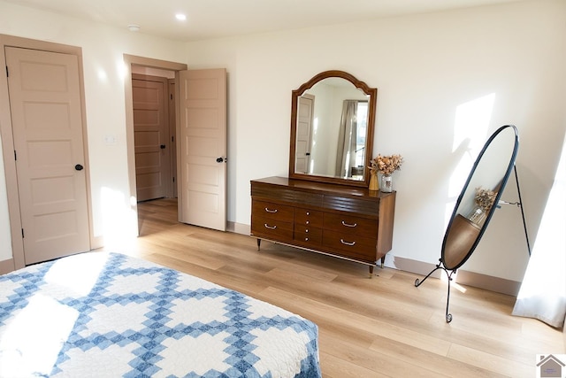bedroom with light hardwood / wood-style flooring
