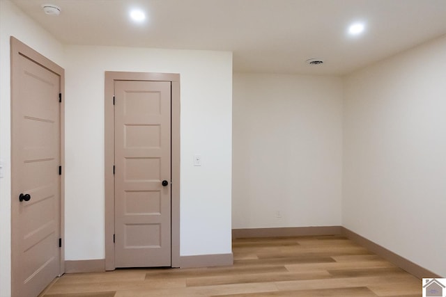 spare room with light hardwood / wood-style floors