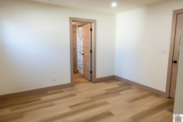 spare room with light wood-type flooring