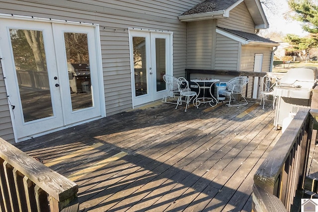 wooden deck featuring area for grilling and french doors