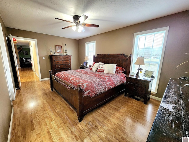 bedroom featuring ceiling fan and light wood-type flooring