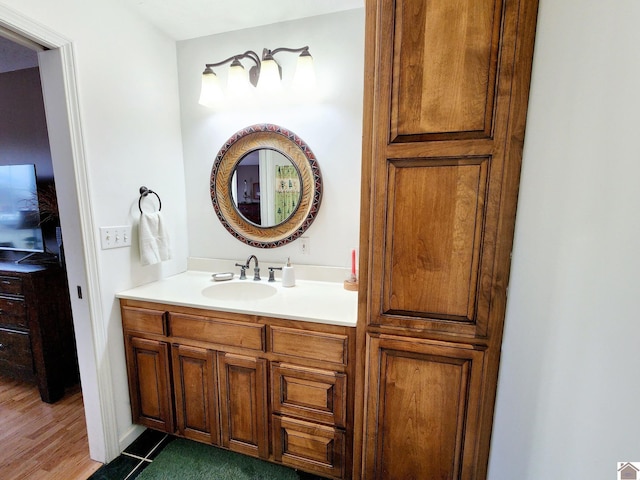 bathroom featuring vanity and wood-type flooring