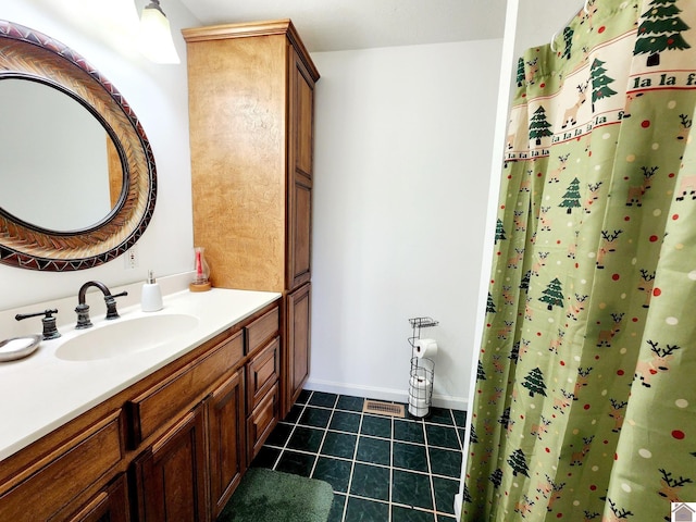 bathroom featuring tile patterned floors and vanity