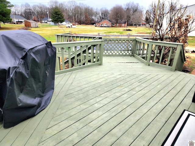 wooden deck featuring area for grilling