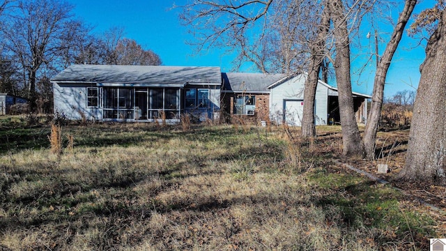 view of front of home with a sunroom