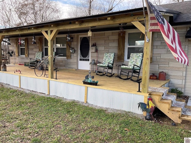 back of property featuring a porch