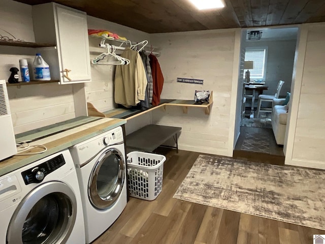 laundry area with separate washer and dryer, wooden ceiling, cabinets, and dark hardwood / wood-style floors