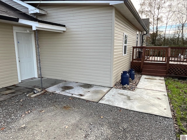 view of home's exterior featuring a wooden deck