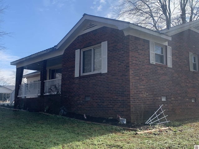 view of home's exterior with a yard