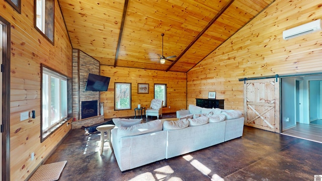 living room featuring beamed ceiling, a barn door, wood ceiling, and high vaulted ceiling