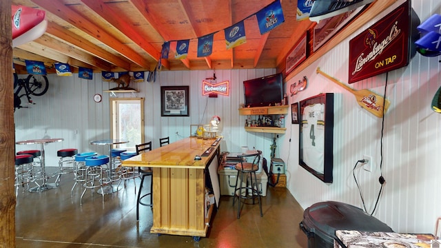 bar featuring wood walls