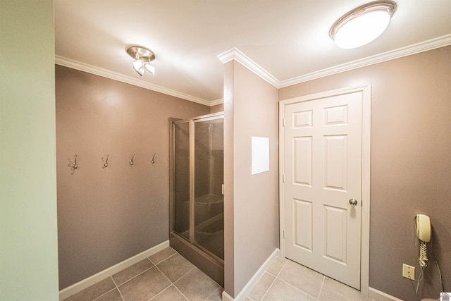 bathroom with tile patterned floors, walk in shower, and crown molding