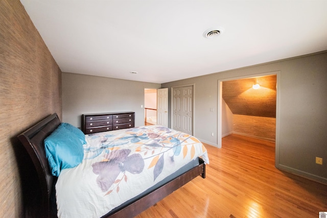 bedroom with light wood-type flooring