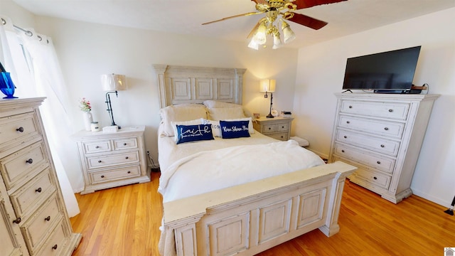 bedroom featuring light hardwood / wood-style flooring and ceiling fan