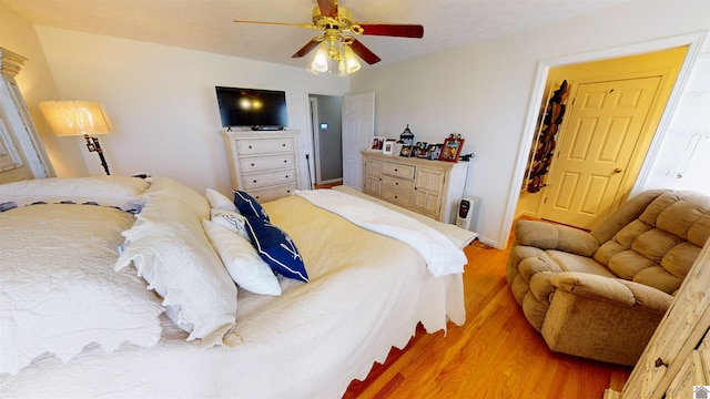 bedroom featuring ceiling fan and light hardwood / wood-style floors