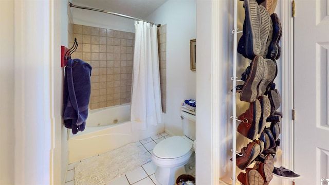 bathroom with tile patterned flooring, shower / bath combination with curtain, and toilet