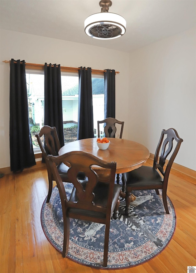 dining space featuring hardwood / wood-style flooring