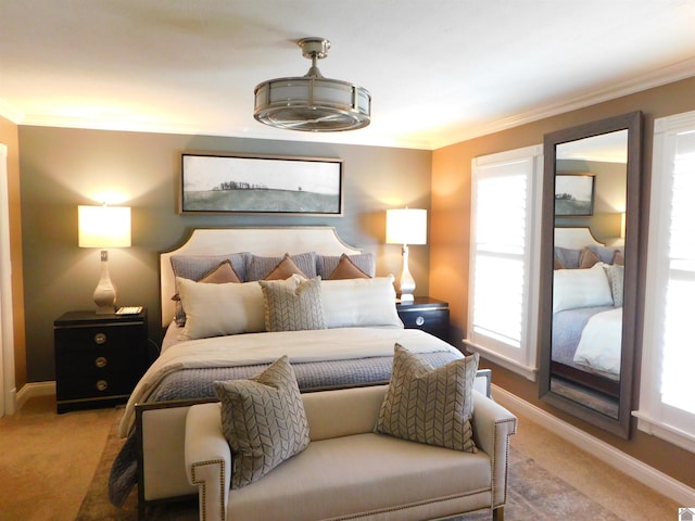 carpeted bedroom featuring ornamental molding