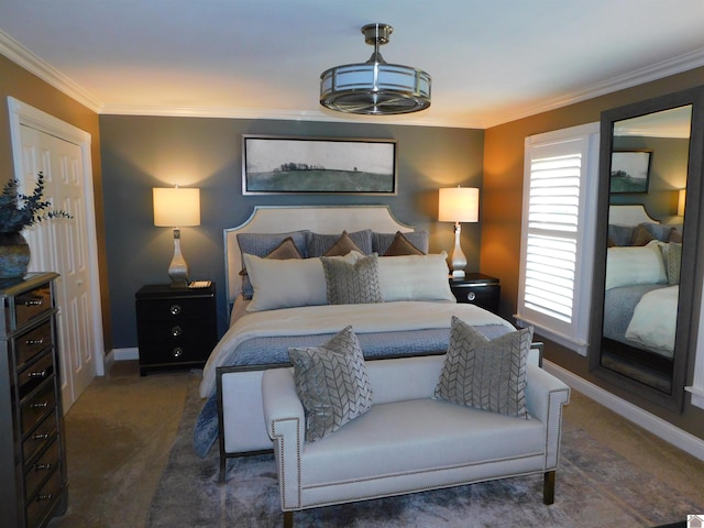 bedroom with dark colored carpet and crown molding