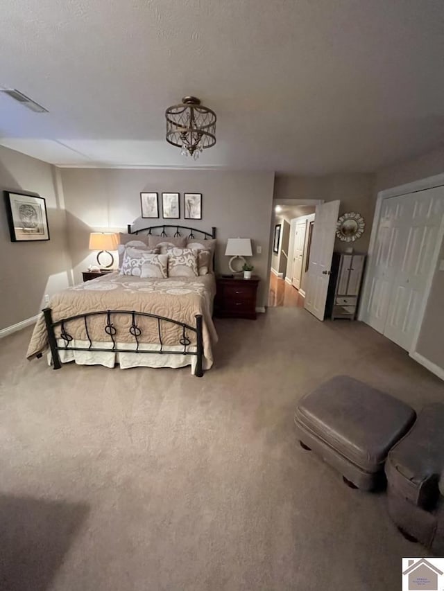 bedroom with a closet and carpet