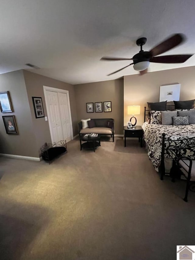 carpeted bedroom with a closet and ceiling fan