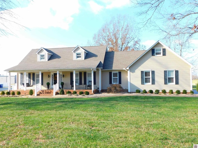 cape cod home with a porch and a front lawn