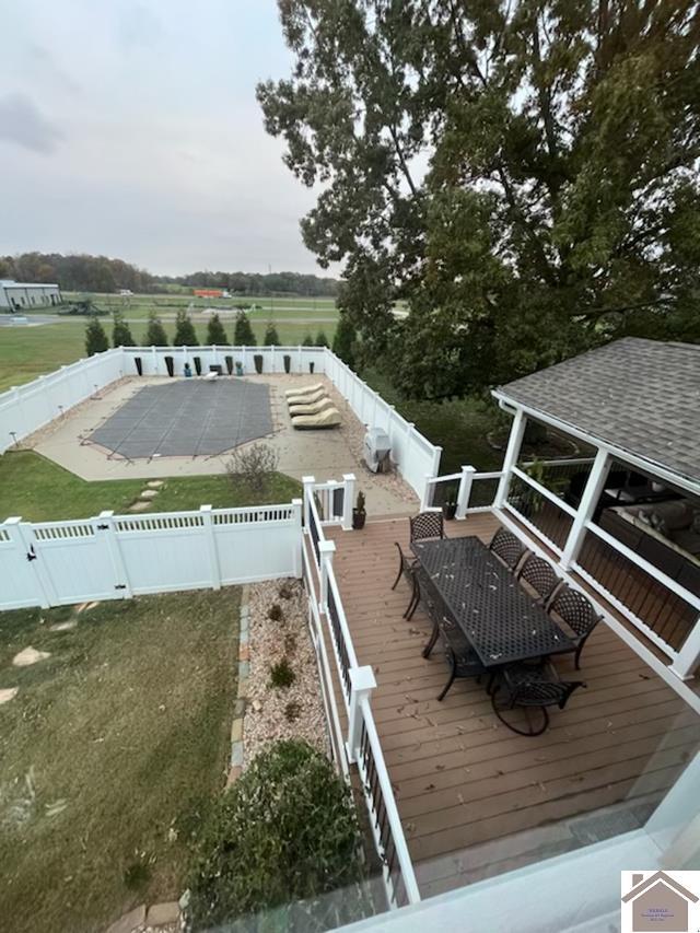 wooden deck with a yard