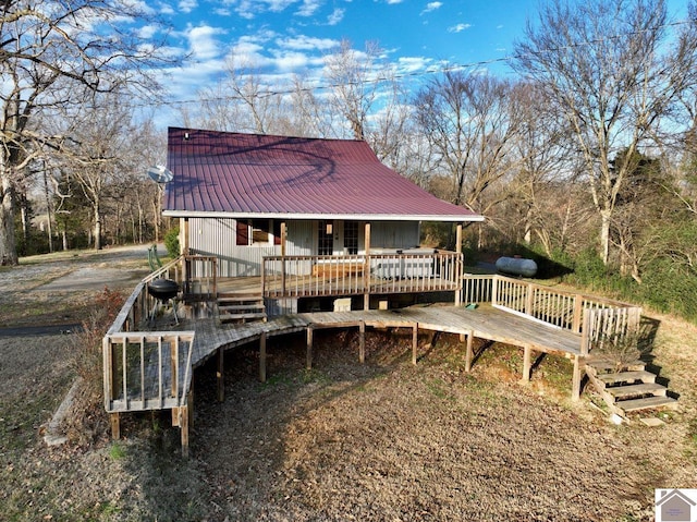 back of property with a wooden deck