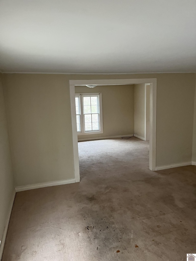 empty room featuring light carpet