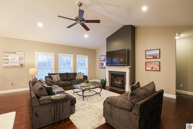 living room featuring dark hardwood / wood-style floors, ceiling fan, and lofted ceiling