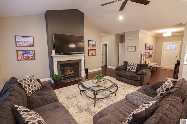 living room with crown molding, dark hardwood / wood-style flooring, ceiling fan, and lofted ceiling