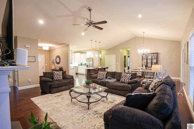 living room with ceiling fan with notable chandelier, dark wood-type flooring, lofted ceiling, and ornamental molding