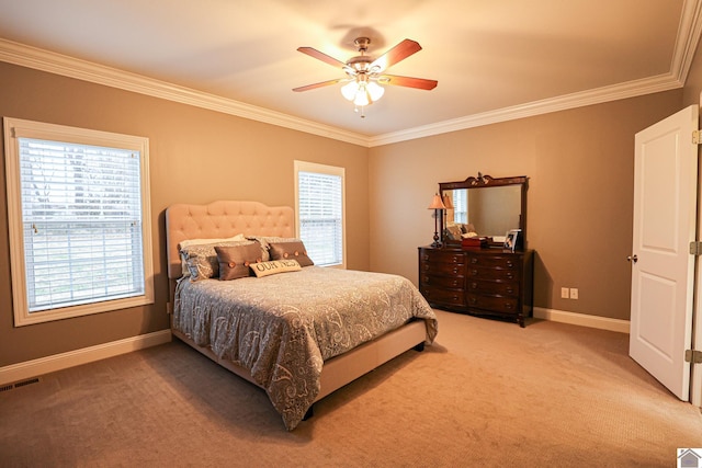 carpeted bedroom featuring ceiling fan and ornamental molding