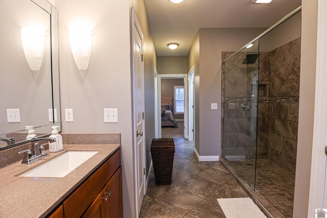 bathroom featuring vanity and a shower with shower door